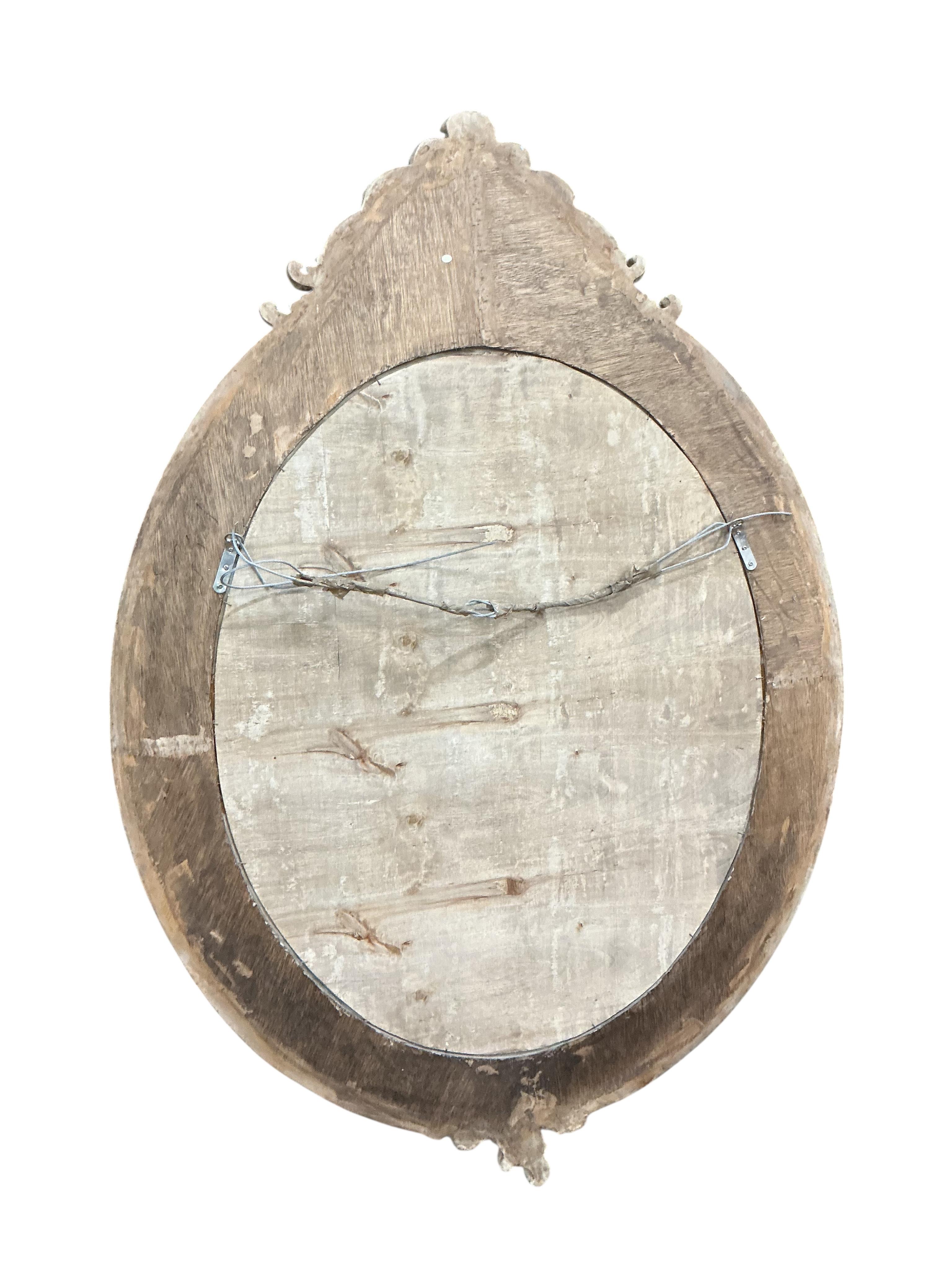 A Victorian style compostion faux marble oval wall mirror, width 104cm, height 148cm